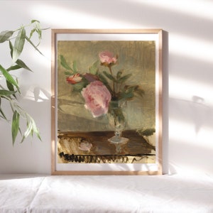 May include: A painting of pink peonies in a glass vase on a wooden table. The flowers are arranged in a loose, natural style, and the vase is simple and elegant. The painting is done in a realistic style, with soft brushstrokes and muted colors.