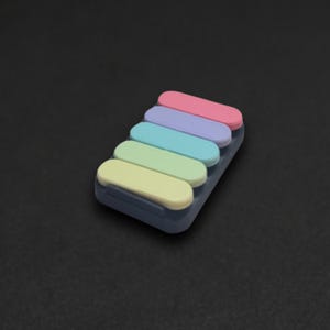 SnapStrip™ - Bande anti-stress à bascule à 5 cliquets