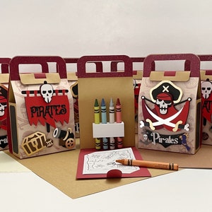 May include: Set of six pirate-themed party favor boxes with a red, white, and black color scheme. Each box features a pirate skull and crossbones design, the word "Pirates", and a small coloring book and crayons.