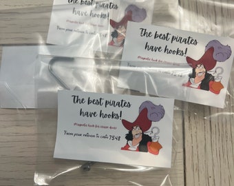 May include: Clear plastic bags containing magnetic hooks with printed cards. The cards feature an illustration of Captain Hook and the text "The best pirates have hooks!" and "From your friends in cabin 7548".