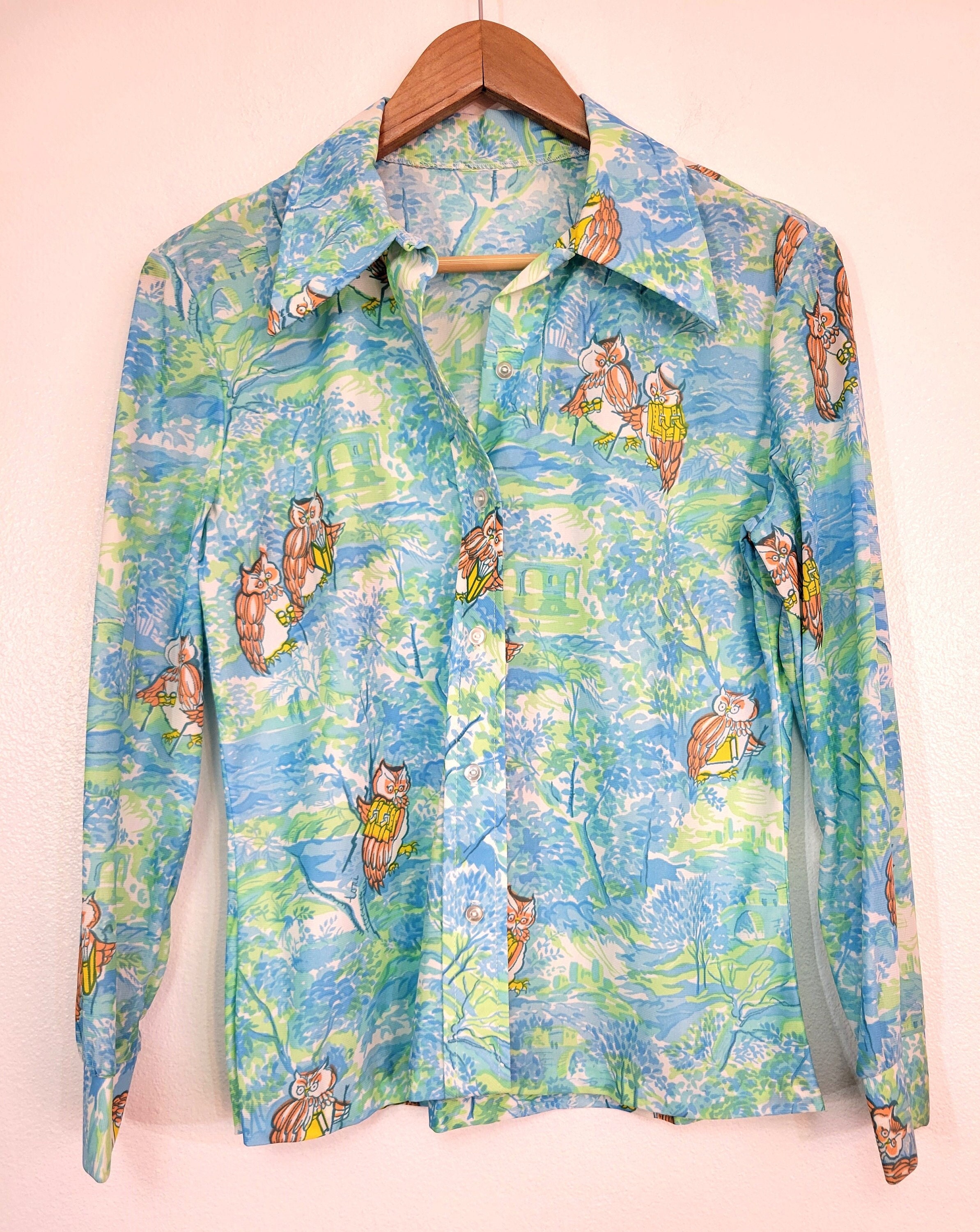 Nik Nik 1970s Vintage Print Disco Shirt: 70s -Nik Nik- Mens shiny light  blue background nylon button cuff longsleeve button up front print disco  shirt with shades of green, blue, orange, pink