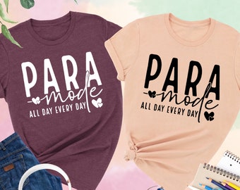 May include: Two t-shirts with the text "PARA mode ALL DAY EVERY DAY" in black and white. The shirts are heather maroon and heather peach.