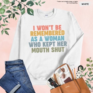 a white shirt with the words i won't be remembers as a woman who