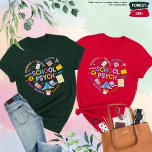 May include: Two t-shirts, one green and one red, featuring a graphic design of a circle containing the words "School Psych" and various icons related to the profession, such as a heart, a pencil, a calendar, a folder, a laptop, a coffee cup, a bell, and a psychology symbol.