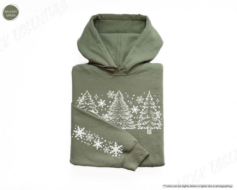 May include: A green hooded sweatshirt with a white design of stylized pine trees and snowflakes.
