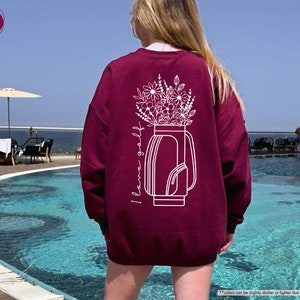a woman standing in front of a swimming pool