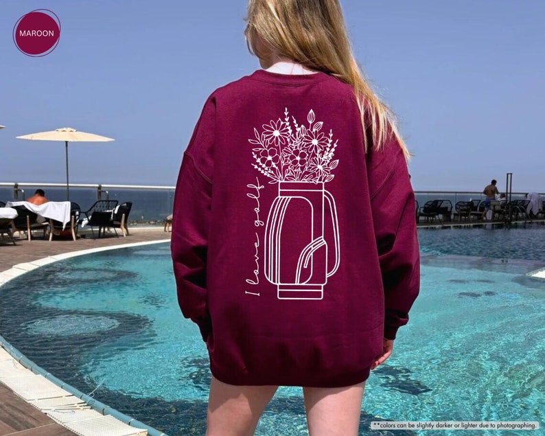 a woman standing in front of a swimming pool