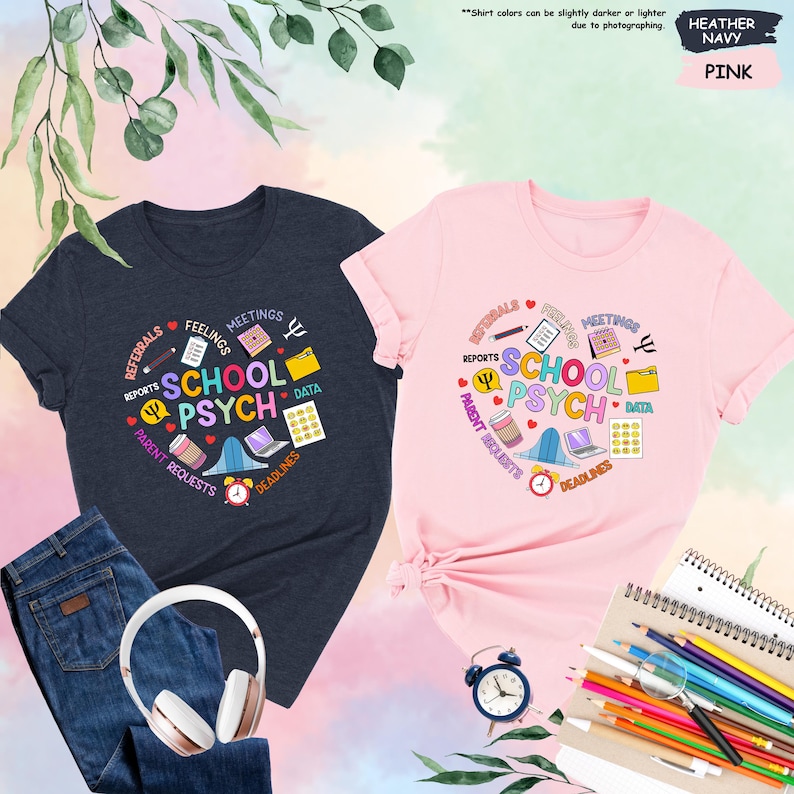 May include: Two t-shirts, one heather navy and one pink, featuring a graphic design representing the work of a school psychologist. The design includes icons such as reports, feelings, meetings, data, deadlines, and parent requests. The text on the shirts reads "School Psych".