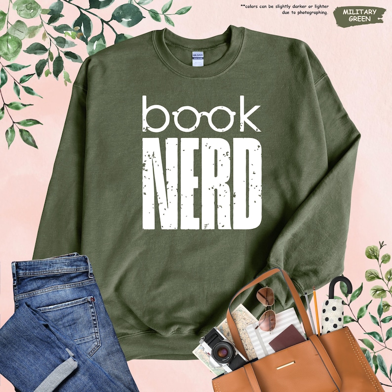 a book nerd sweatshirt, jeans, purse, and handbag