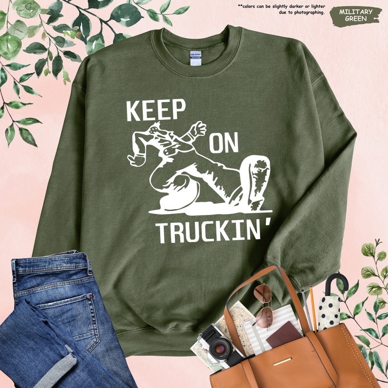 a green shirt with a picture of a person on it