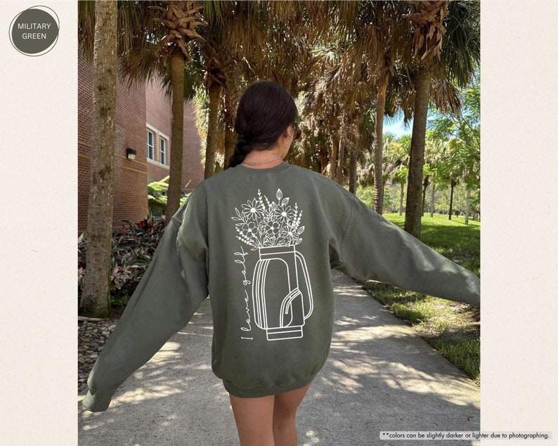 a woman walking down a sidewalk with her arms outstretched