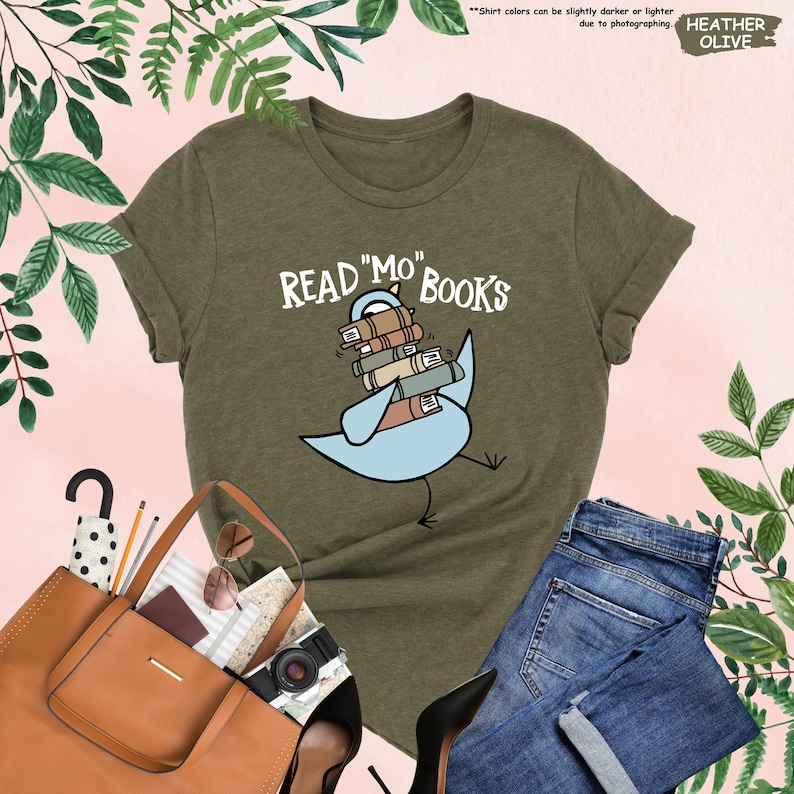 a t - shirt that reads read me books with a bird on it
