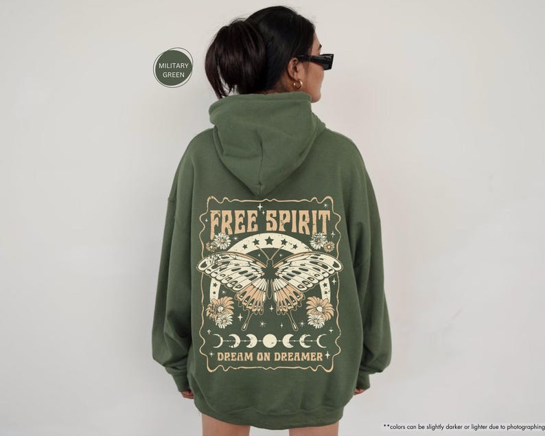 a woman wearing a green hoodie with the words free spirit on it