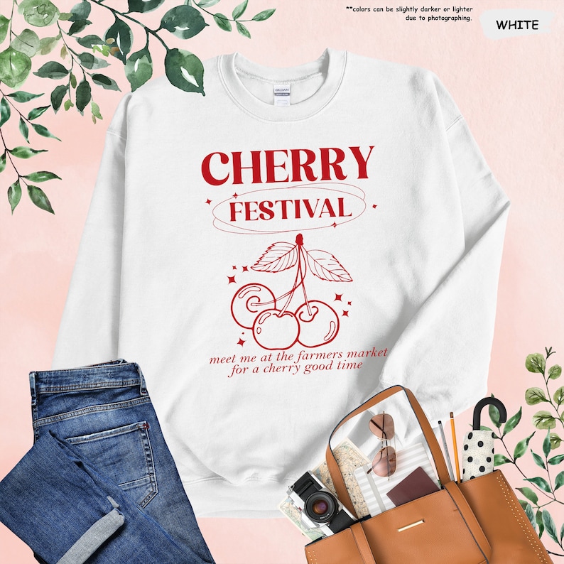 a white sweatshirt with cherry festival on it