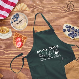 May include: A green kitchen apron with a white pocket and the text "PO-TA-TOES" with three icons depicting different ways to prepare potatoes: boil, mash, and stick in and stew.