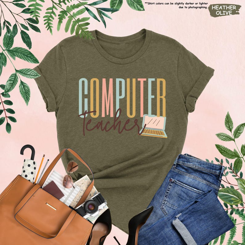a women's t - shirt that says computer teacher next to a handbag