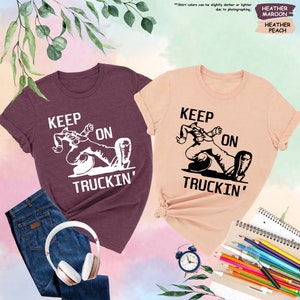a pair of t - shirts that say keep on truckin '