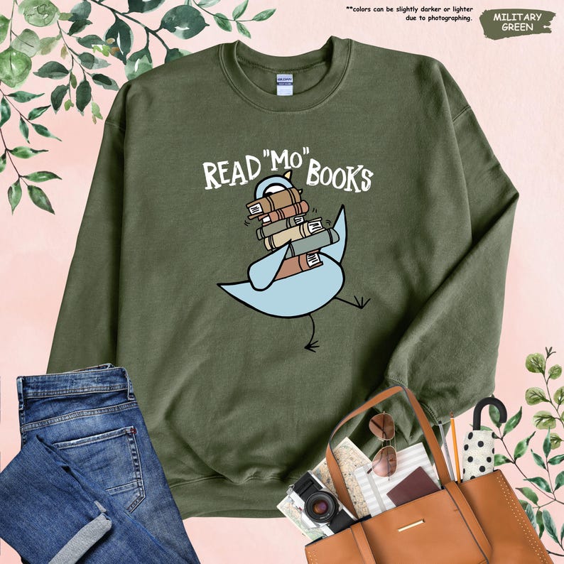 a green sweatshirt with a picture of a boat on it