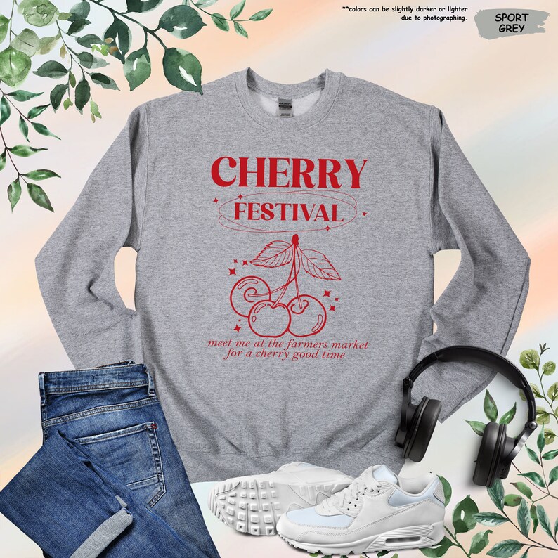 a sweatshirt with a pair of headphones and a pair of jeans