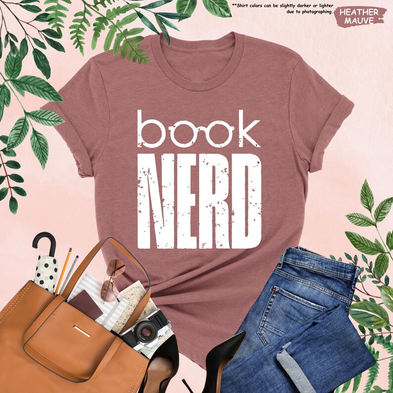 a t - shirt that says book nerd next to a pair of jeans and