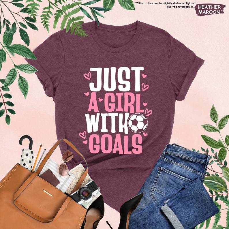 a t - shirt that says just a girl with goals