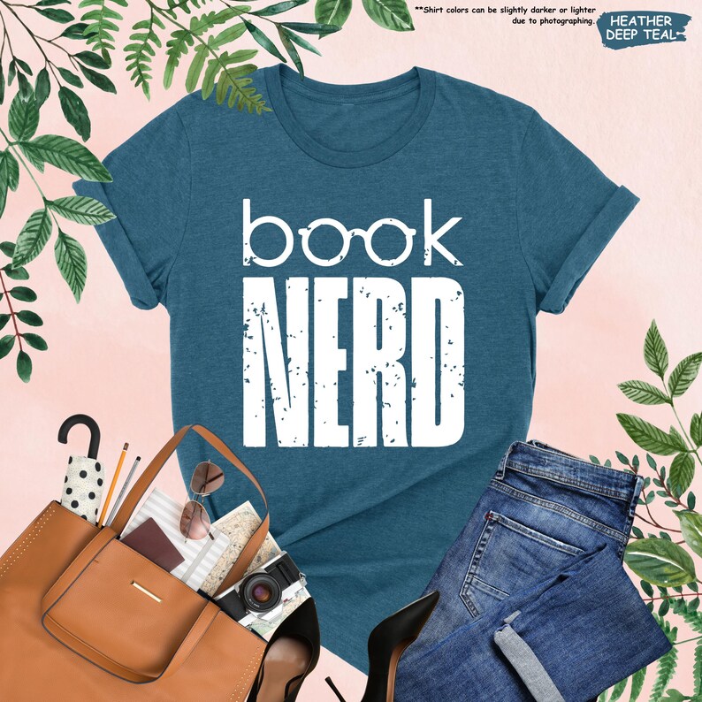 a t - shirt that says book nerd next to a pair of jeans and