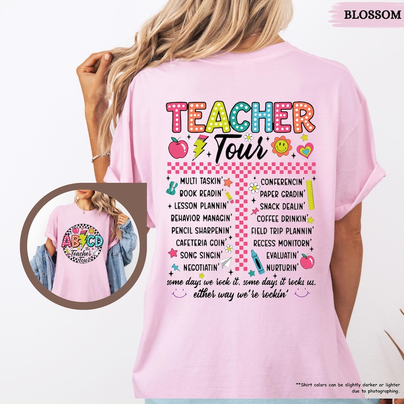May include: Pink t-shirt with a colorful graphic that says "Teacher Tour" and lists tasks a teacher does, such as "Multi Tasking", "Book Readin", "Lesson Plannin", "Conferencing", "Paper Gradin", "Snack Dealin", and "Coffee Drinkin".