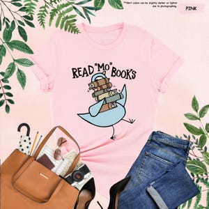 a t - shirt that says read mo books with a bird on it