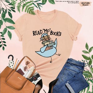 a t - shirt that says read'm'books with a bird on it