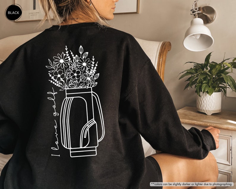 a woman sitting in a chair with a vase of flowers on her back