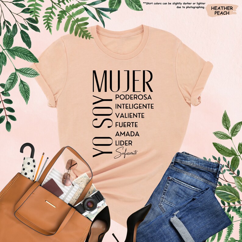 a t - shirt that says mujer and a purse next to it