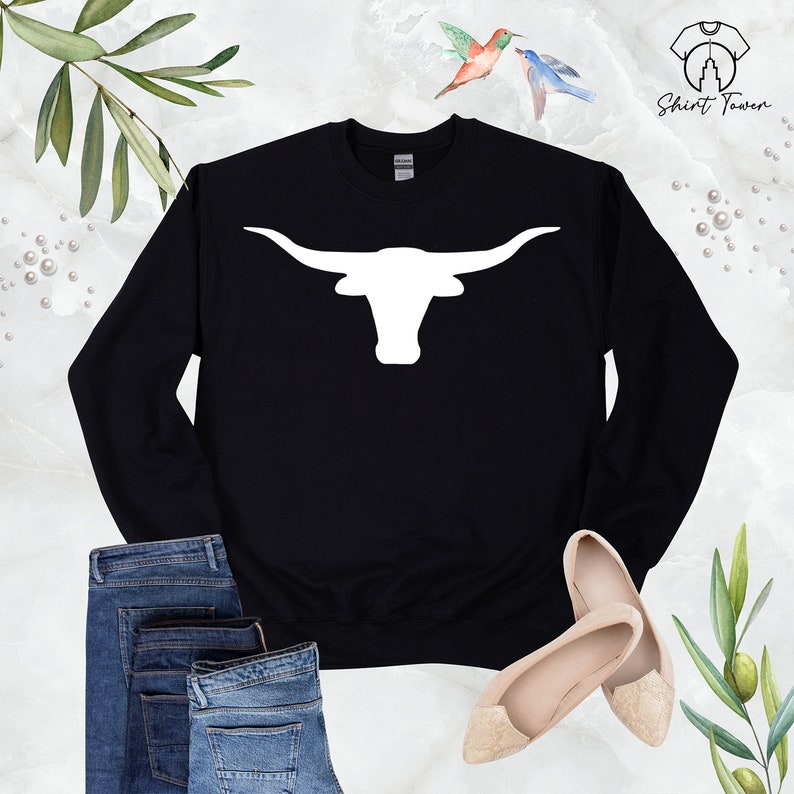 May include: Black sweatshirt with a white silhouette of a longhorn steer head with large horns.