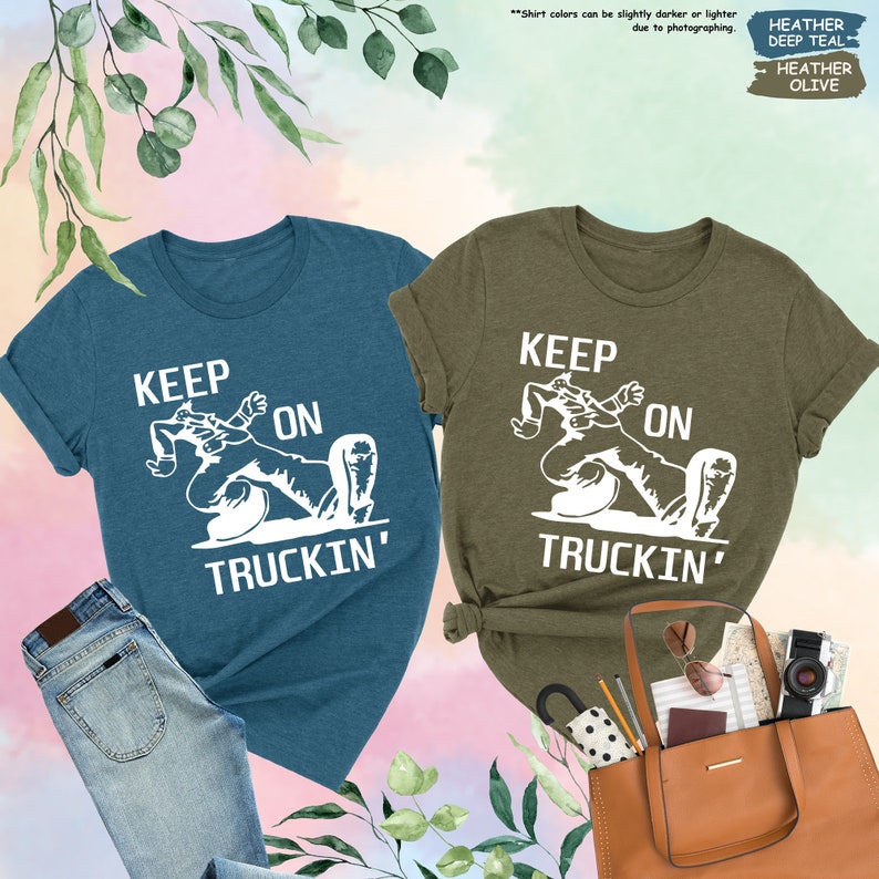 a couple of shirts that are next to a purse