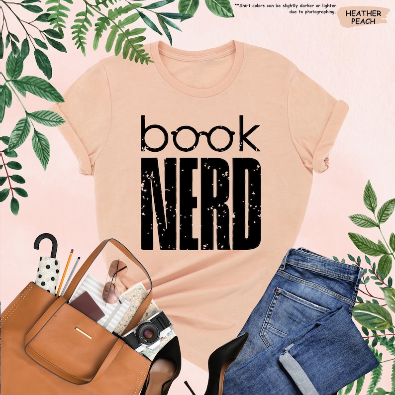 a t - shirt that says book nerd next to a handbag and purse