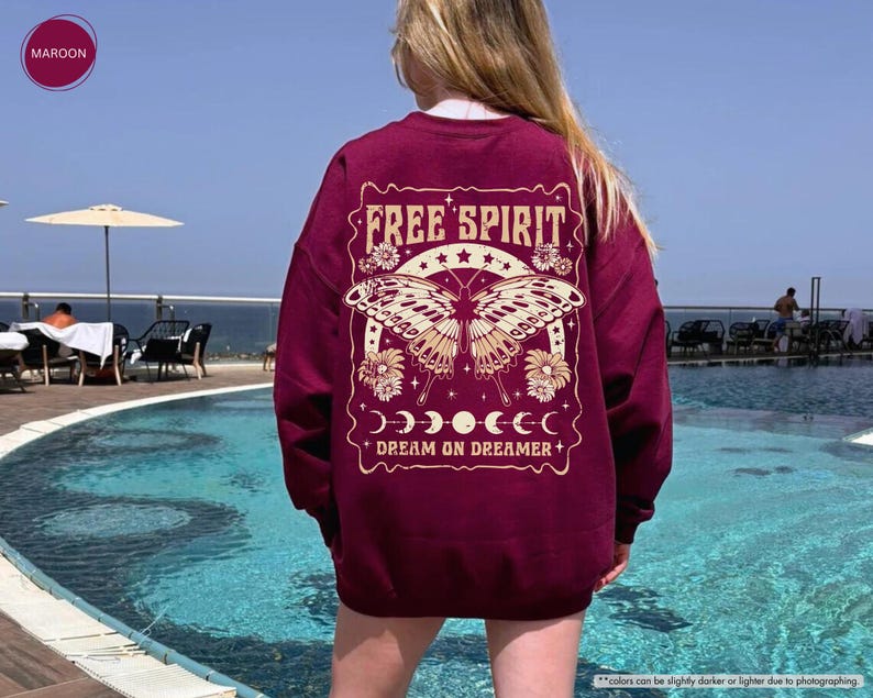 a woman standing in front of a swimming pool