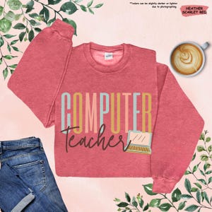 a computer teacher shirt with a cup of coffee next to it