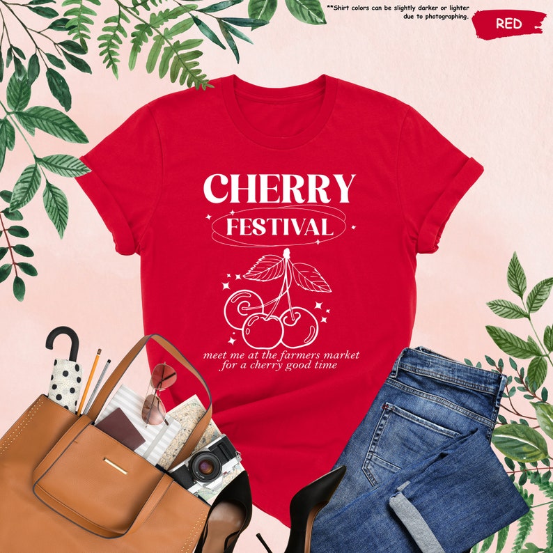a red shirt with a cherry festival on it