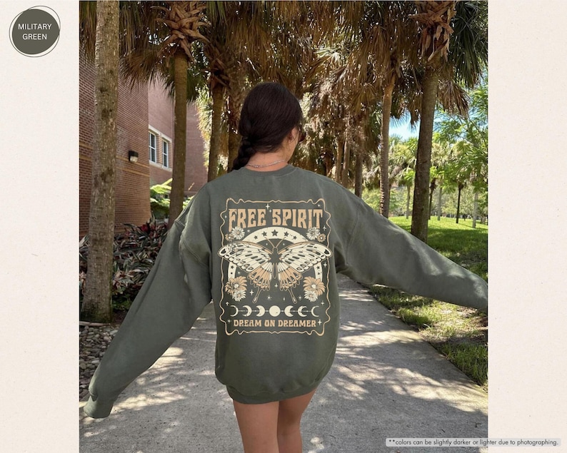 a woman walking down a sidewalk with her arms outstretched