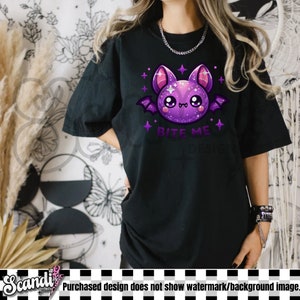 May include: Black t-shirt with a purple cartoon bat with glitter and the text "Bite Me" in white.
