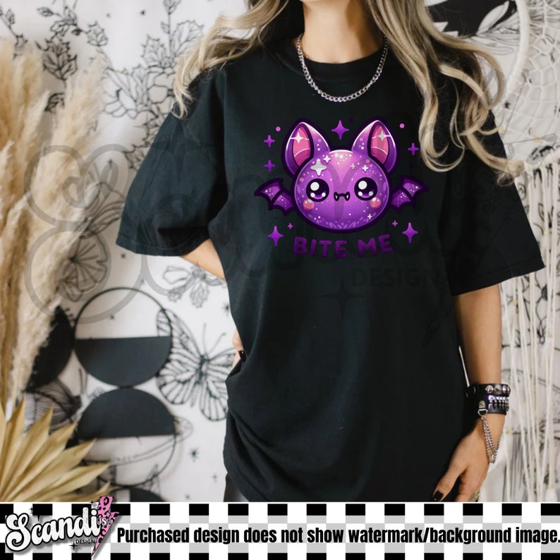 May include: Black t-shirt with a purple cartoon bat with glitter and the text "Bite Me" in white.