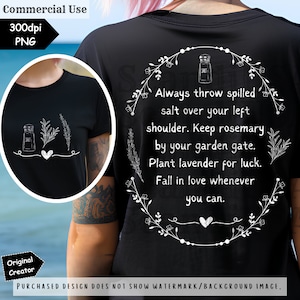 May include: Black t-shirt with a white graphic of a salt shaker, herbs, and a heart. The back of the shirt features a floral wreath with text: "Always throw spilled salt over your left shoulder. Keep rosemary by your garden gate. Plant lavender for luck. Fall in love whenever you can."