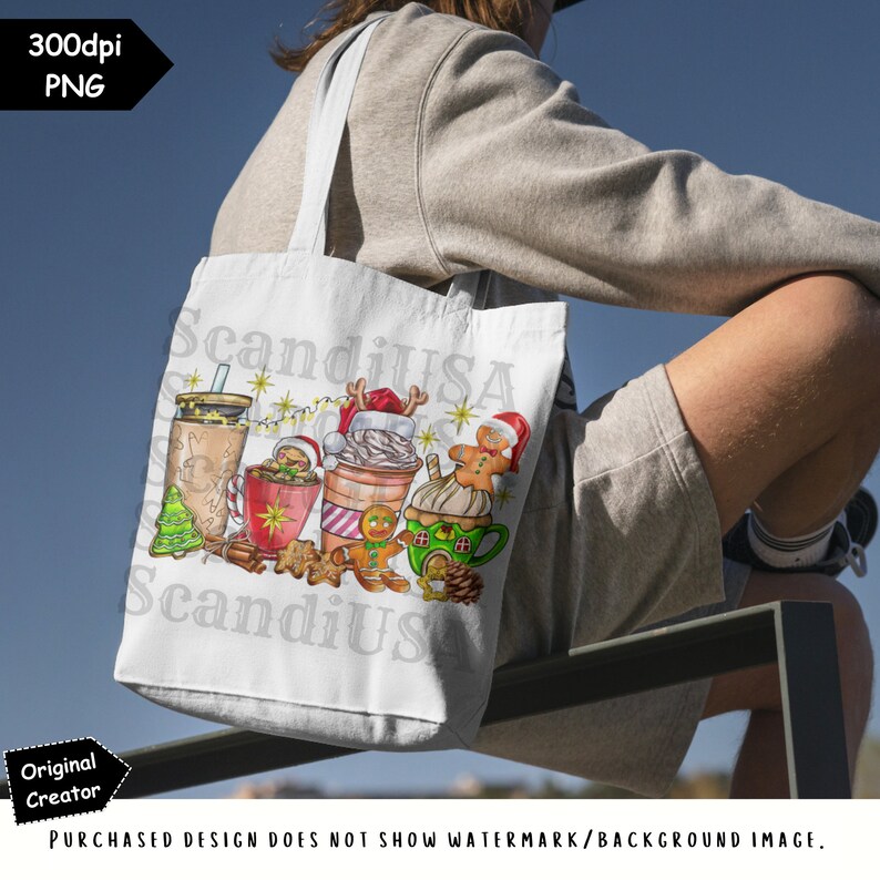 May include: A white tote bag with a Christmas-themed design featuring a gingerbread man, a mug of hot chocolate, and a cup of coffee. The design also includes a Christmas tree, a Santa hat, and a string of lights. The text "ScandiUSA" and "ScandiUS" is visible on the bag.