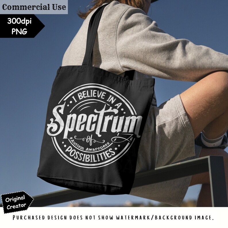 May include: A black tote bag with a white circle design that says "I believe in a spectrum of possibilities." The text "Autism Awareness" is also included in the design.