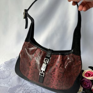 Bolso pequeño tipo hobo Gucci Jackie vintage de piel de pitón.