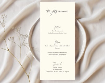 Puede incluir: Una tarjeta de menú simple y elegante con el título "tonight's FEASTING" impreso en letra cursiva. El menú presenta una comida de tres platos: Arancini de trufa y bocados de pollo asado con coco para la entrada, panceta de cerdo y ensalada de cítricos con almendras en escamas y barramundi asado con salsa beurre blanc y rosti de patata para el plato principal, y tabla de quesos y pastel de boda para el postre.