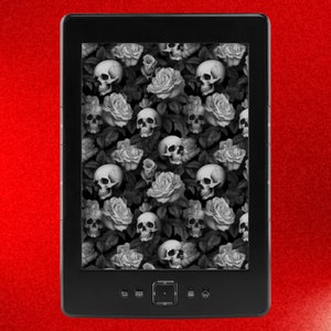 May include: A black and white e-reader with a screen displaying a pattern of skulls and roses. The e-reader has a black frame and a touch screen.
