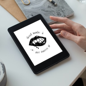 May include: A black and white illustration of a vampire mouth with fangs and dripping blood. The text "dead inside, but smutty af" is below the image.
