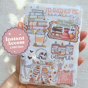 May include: A clear phone case with a white background and a variety of colorful illustrations. The illustrations include a stack of books, a skeleton, a pumpkin, a coffee cup, and a sweater. The text "I'd rather be reading" and "Getting Lit" are also included on the case.