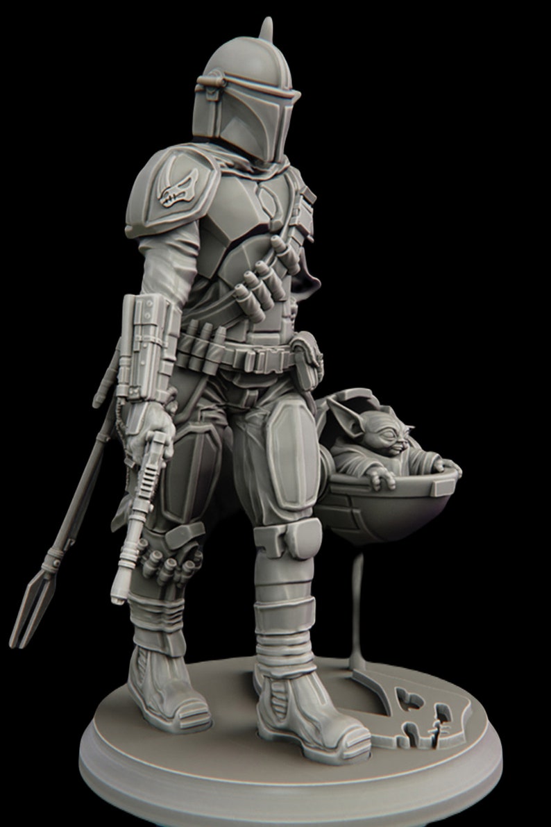 May include: A gray, detailed, 3D printed figurine of a Mandalorian warrior with a jetpack and a rifle. The Mandalorian is holding a small, gray, 3D printed figurine of a baby Yoda in a floating pod.