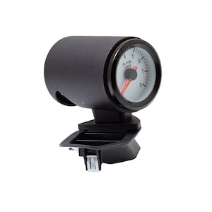 May include: A black and white car gauge with a red needle. The gauge is labeled "R.P.M. x1000".